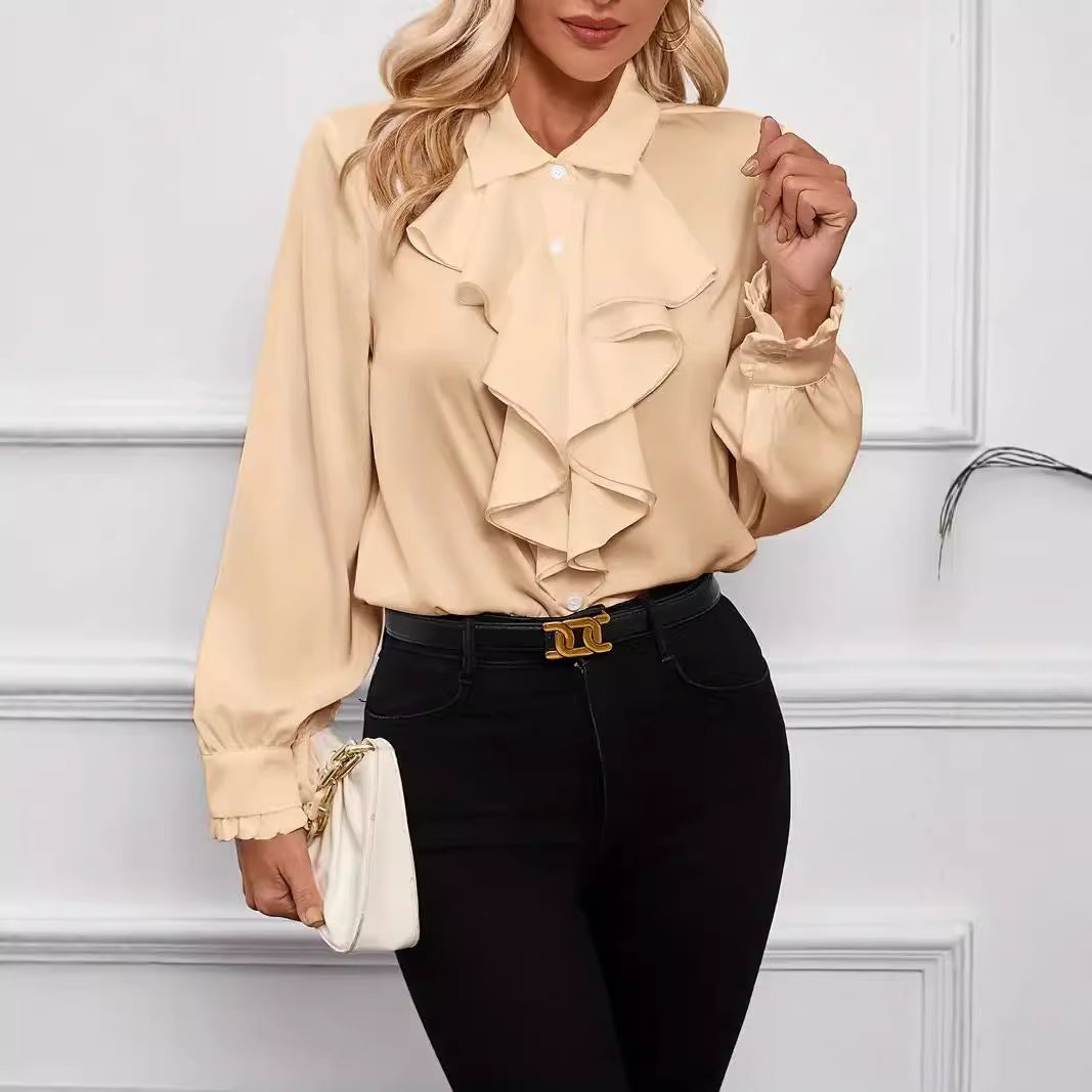 Stylish shirt with ruffled and layered design details.